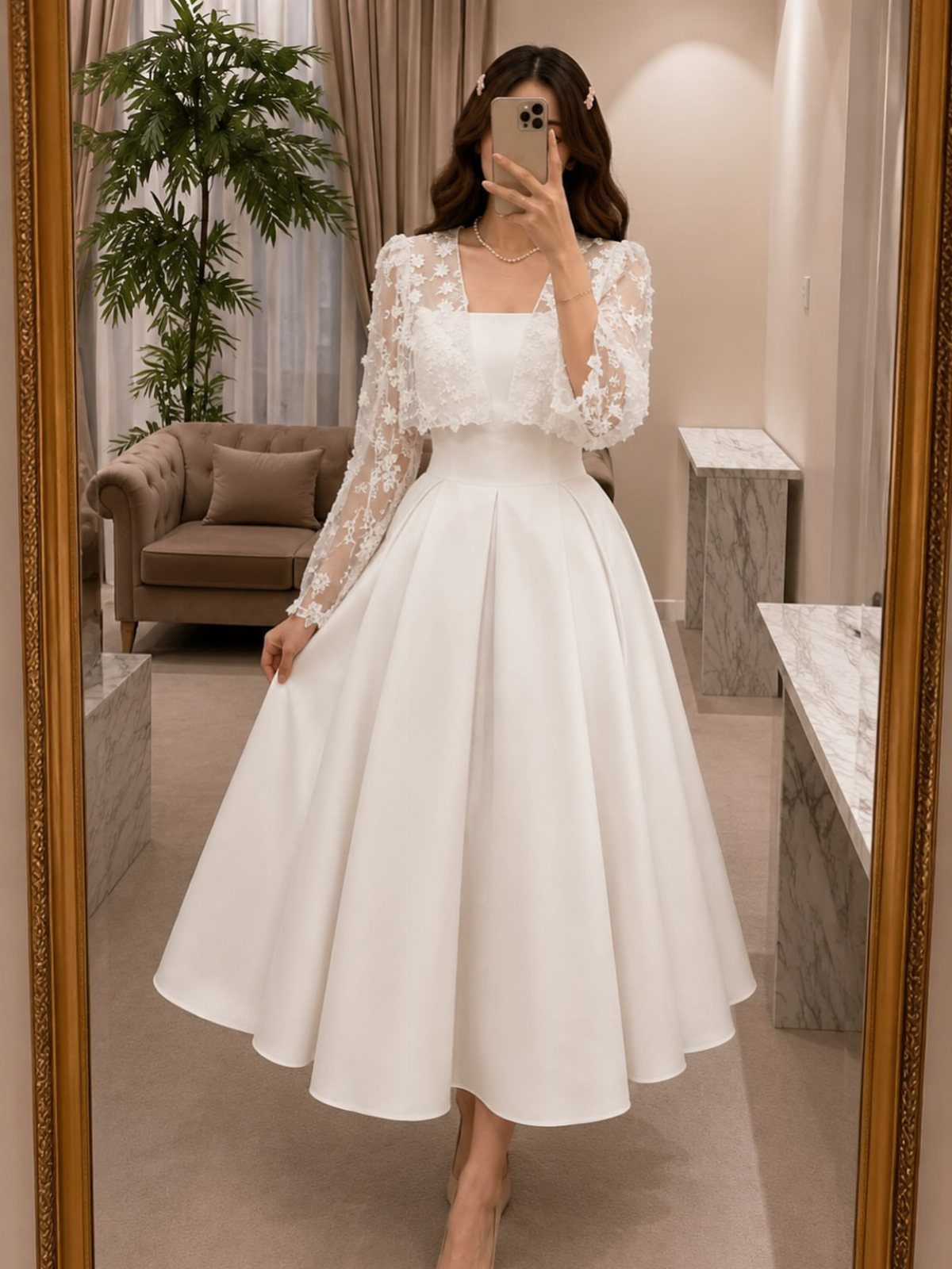 Woman posing in a white lace midi dress with a full satin skirt.