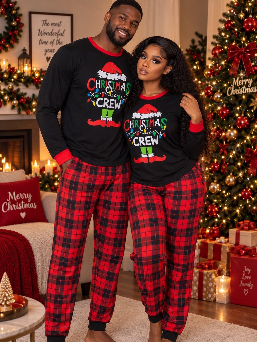 Man and woman wearing matching Christmas crew shirts and red plaid pajama pants.