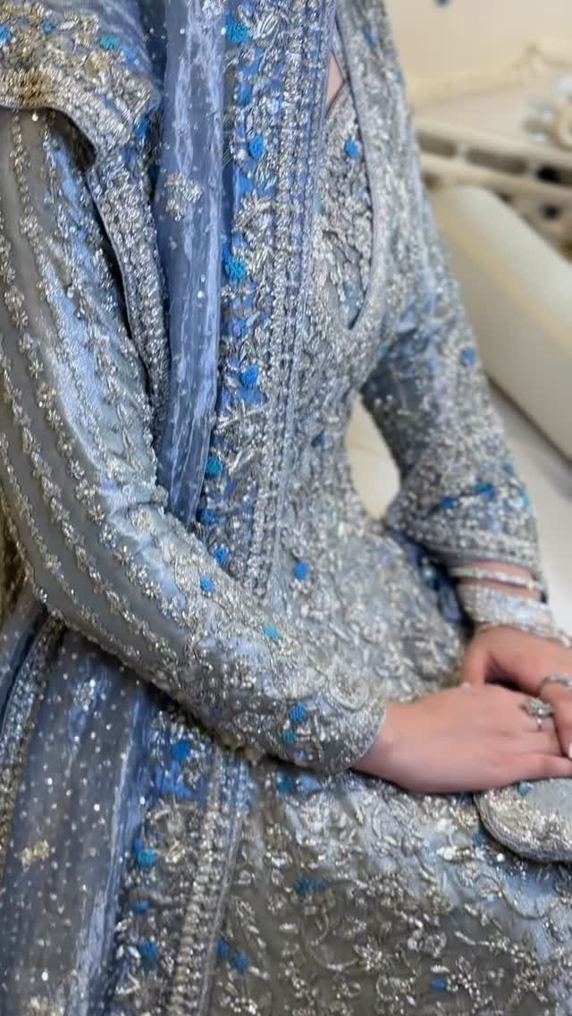 Intricately beaded icy blue formal dress with long sleeves and matching sheer dupatta.